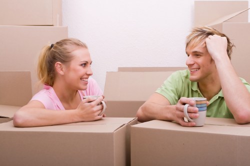 Removal team preparing household items for loading