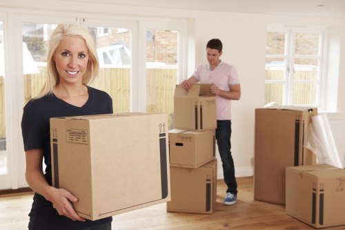 Packing boxes in a Maida Vale flat with careful labeling