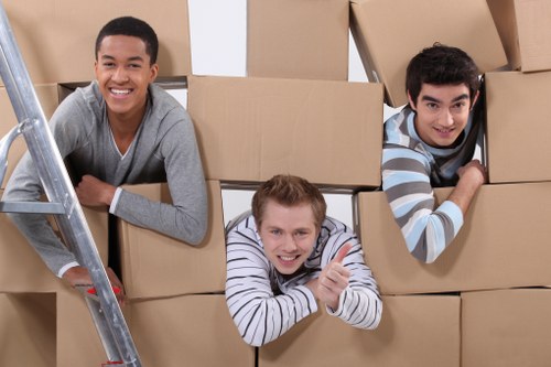 Moving boxes and furniture being prepared for truck hire