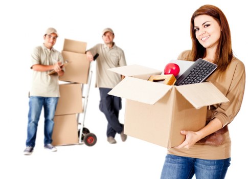 Team using safe manual handling techniques during a move
