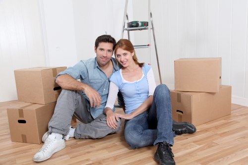 Moving boxes and furniture arranged for a Maida Vale relocation