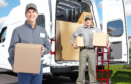 Professional movers navigating access in a Maida Vale apartment building