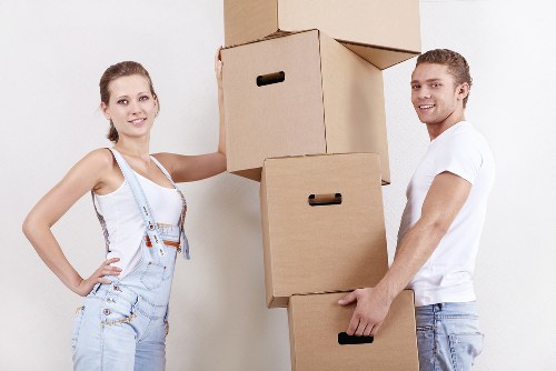 Removal professionals handling furniture in a Maida Vale commercial property