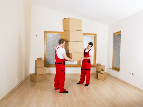 Moving team assessing cubic-yard volume for a home relocation
